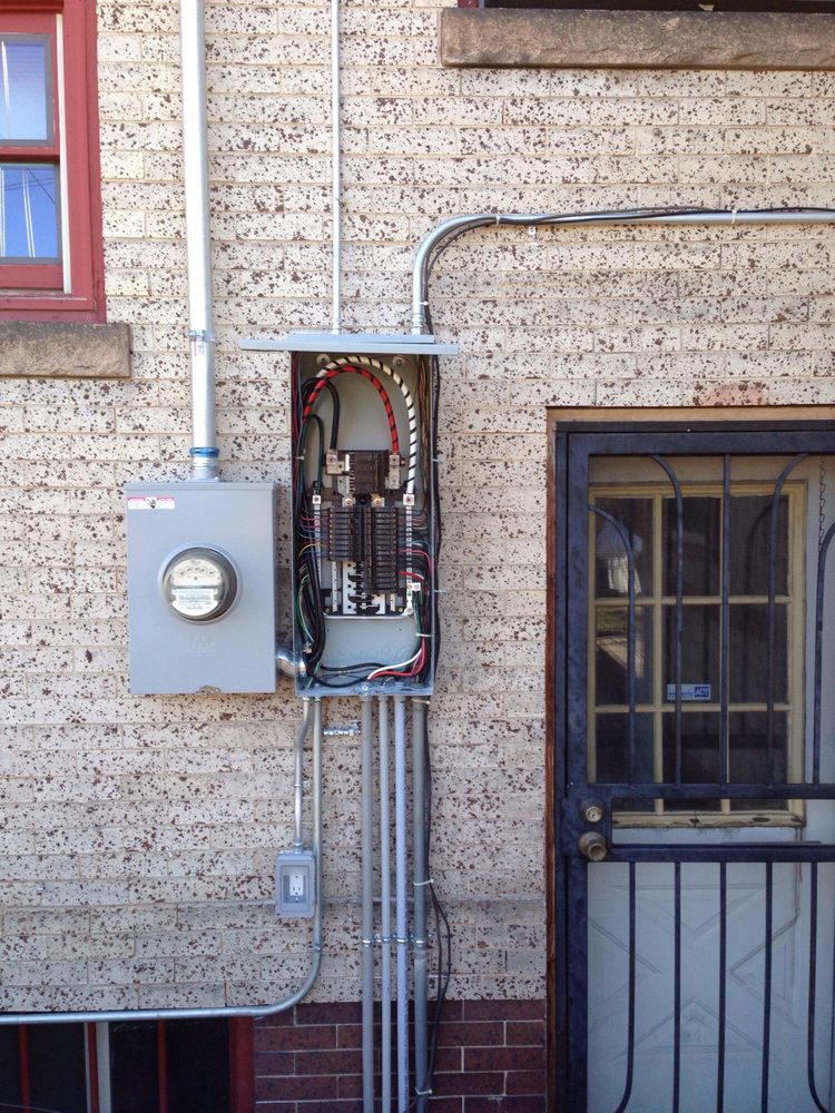 Exterior electrical panel and disconnect installation by Vanguard Electric